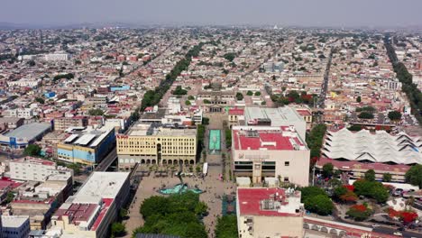 DRONE-DESCENDING-SHOT-OF-DOWNTOWN-GUADALAJARA-AT-NOON