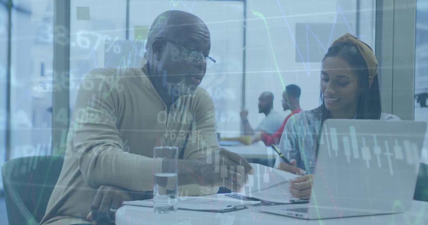 Animation of graphs and trading board over diverse coworkers discussing on desk in office