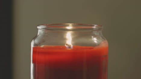 close up of illuminated tea light candle against defocused background