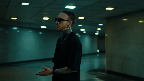 stylish man in underground tunnel