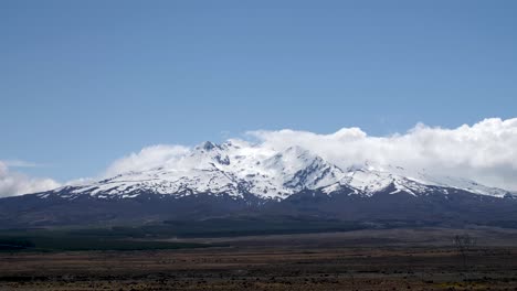 time lapse of mount ruapehu cutting through clouds in new zealand