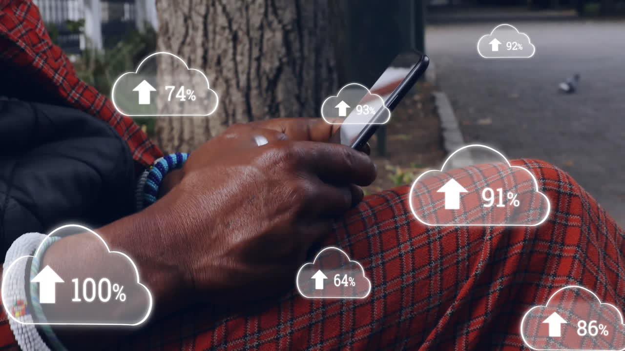 animación de nubes con números crecientes sobre hombre afroamericano usando teléfono inteligente