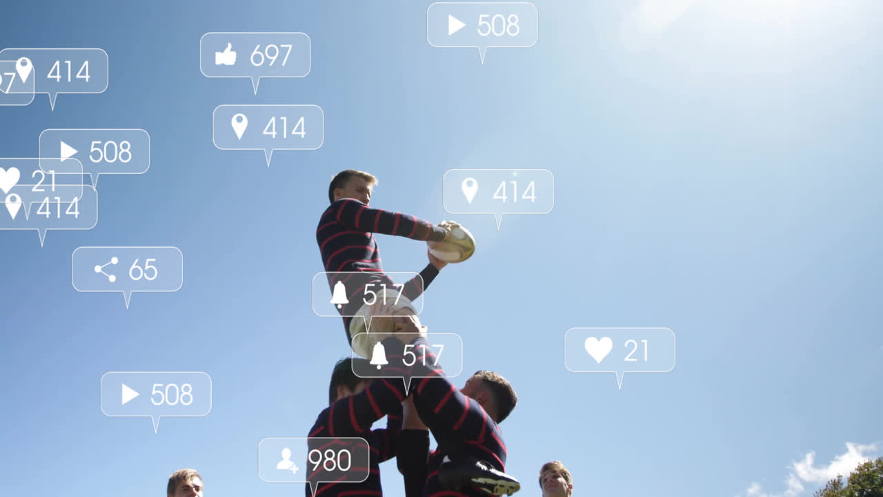 Lifting teammate, rugby players with animation of social media icons in background
