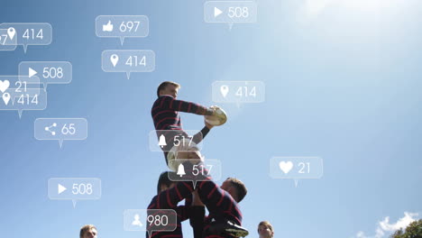 lifting teammate, rugby players with animation of social media icons in background