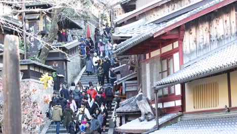 visitors ascending steep stairs at a historic site