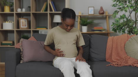 pregnant woman relaxing at home