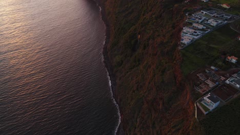 scenic view of estreito da calheta coastal town in madeira island, portugal. aerial drone shot