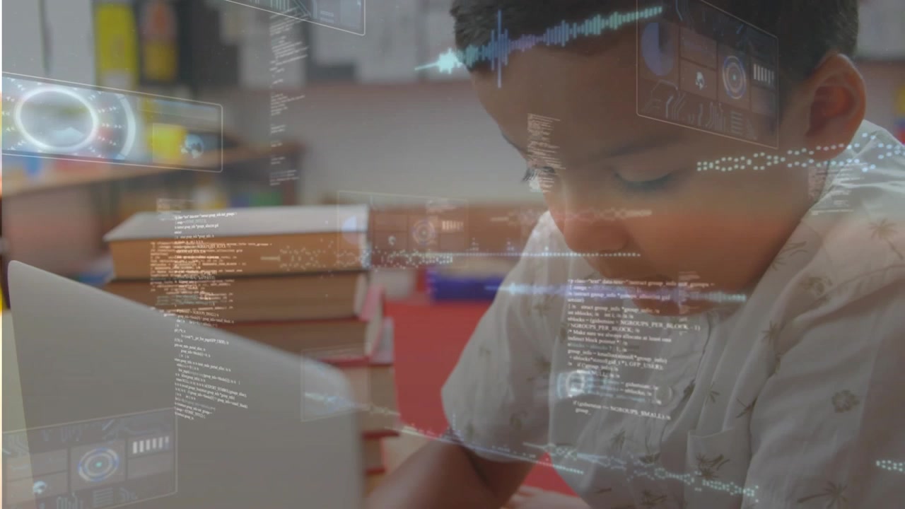 Boy leaning toward white laptop, touching keys and typing, starting HUD overlays for education