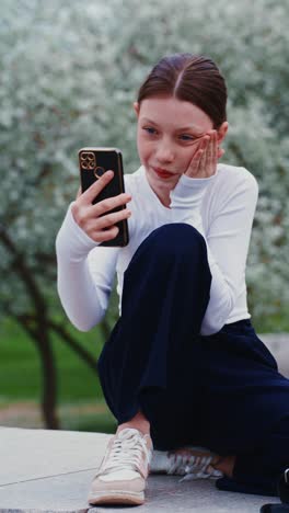 teenager using a smartphone outdoors
