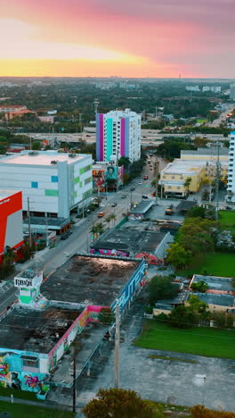 colorful sky above the city panorama at sunset. scenic view of miami, florida, usa from drone. vertical video