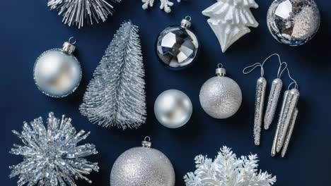 silver christmas decorations on a dark blue background