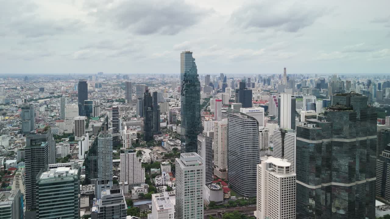 Bangkok Financial District Close-Up Aerial — Tight Framing on Glass Towers and Corporate Plaza