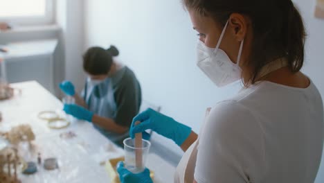 women learning resin crafts