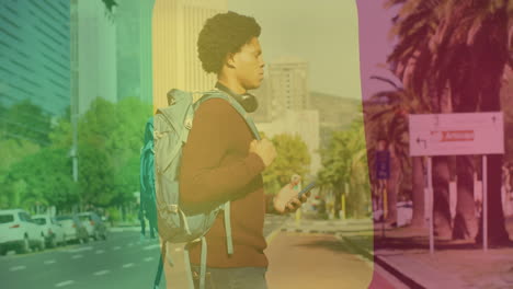 holding phone, person with backpack standing on colorful city street with animation