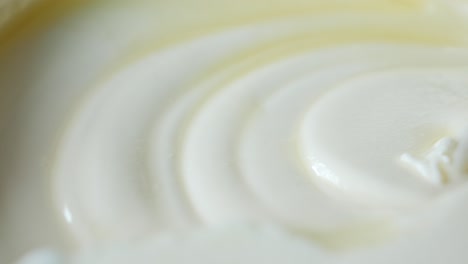 Close-up-of-fresh-butter-in-a-container