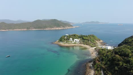 Aerial-view-of-little-palm-beach-villa,-and-a-small-coast-strip-in-Hong-Kong