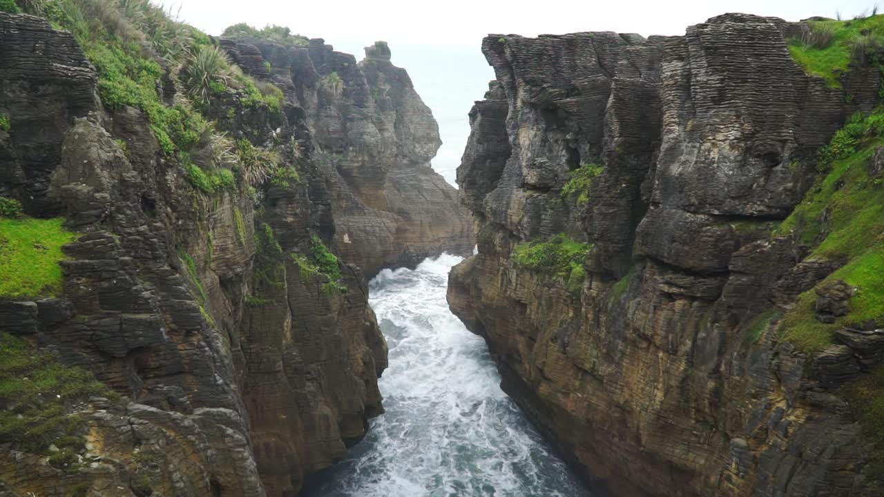 Raging water in chasm at Punakaiki Pancake Rocks, New Zealand