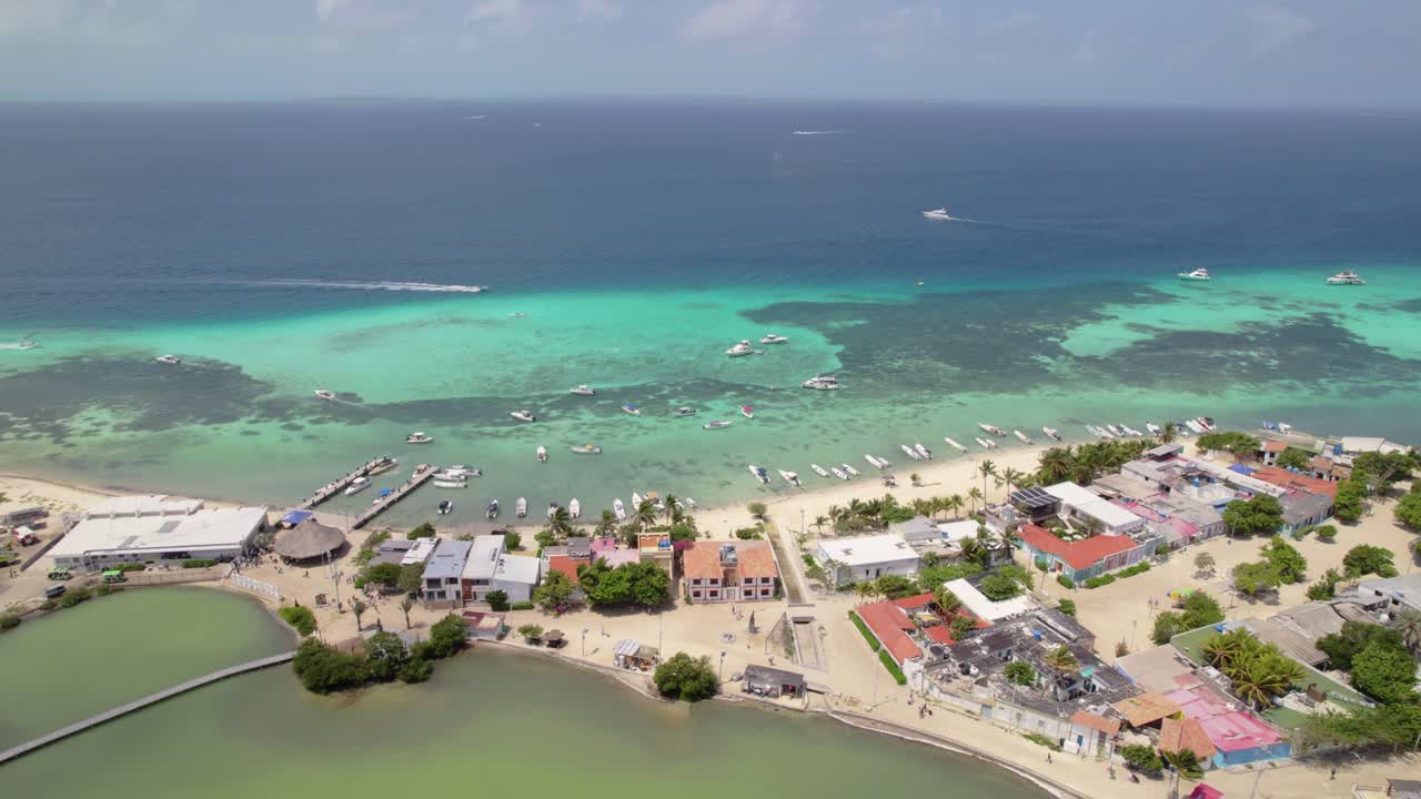 Boats sailing fast in clear turquoise waters leaving trail on water, Los Roques Airport