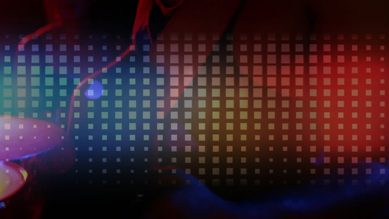 Animated grid pulsing, colored flares revealing female left, male turning right, performing music