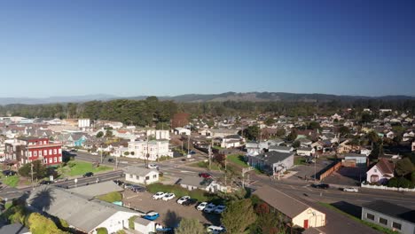 low rising aerial shot of the historic skunk train traveling through fort bragg, california. 4k