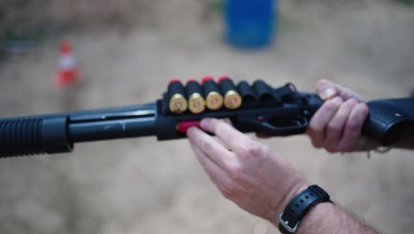 male insert combat ammunition into shotgun barrel chamber, czech republic