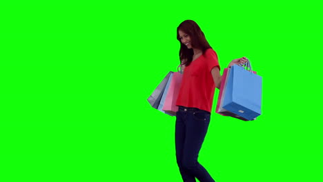 Woman-dancing-while-holding-shopping-bags