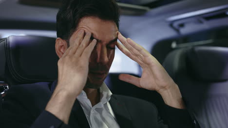 stressed businessman in a car