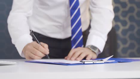 close-up signature. businessman signs the contract with a pen. contract signing. job interview.