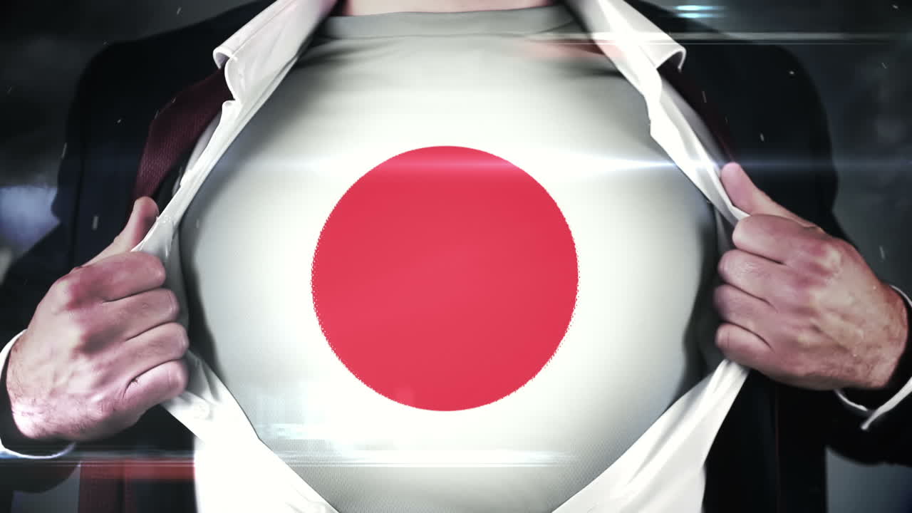 hombre de negocios abriendo la camisa para revelar la bandera de japón