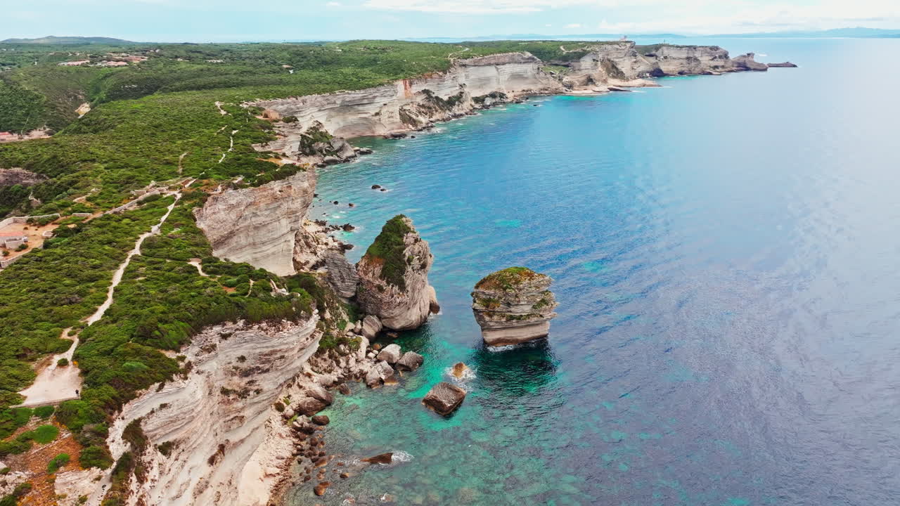 Aerial drone shot over the stunning rugged coastline of southern Corsica, France