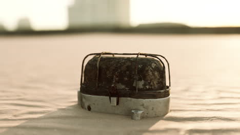 old rusted trash on the sand beach