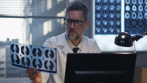 doctor reviewing x-rays on computer