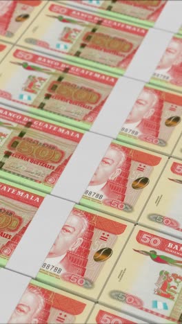 vertical video of 50 guatemalan quetzal banknotes printed by a money press