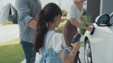 concept of progressive family with home charging station for electric vehicle.