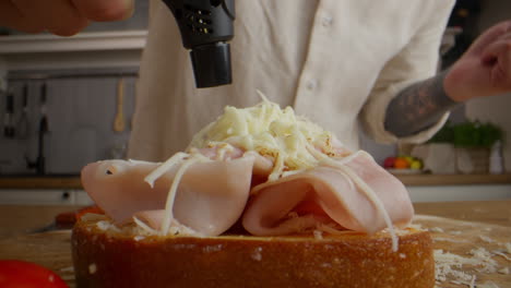 making a delicious ham and cheese sandwich