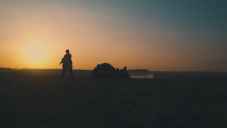 silhouette of overweight woman dancing near evening camping