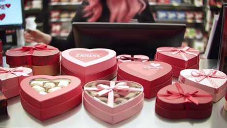 a sweet display of heart-shaped chocolate boxes perfect for any celebration with vibrant packaging and an enticing selection ready for gift-giving or sharing moments