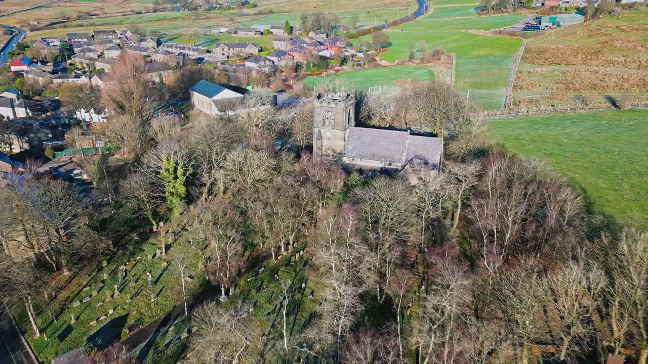 Aerial drone video footage of the small village of Denshaw, a typical rural village in the heart of the Pennines