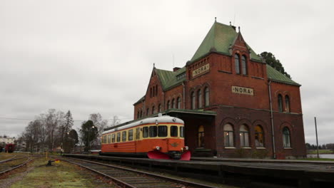 wide shot of an old trainstation in sweden on a cloudy day