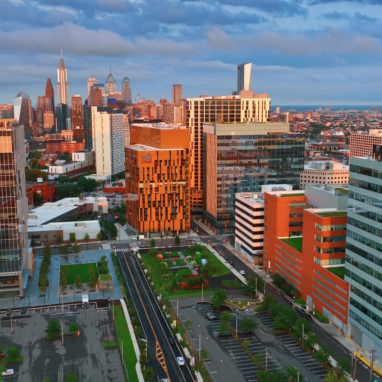 Orange buildings prevailing in the architecture of Philadelphia downtown. Golden hour in metropolis