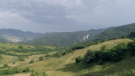 aerial: wonderful view of a mountainous area covered in greenery