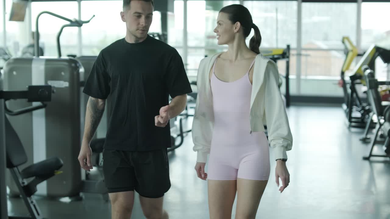 Couple Walking in a Gym