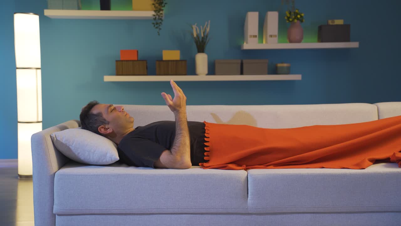 Man praying while lying down.