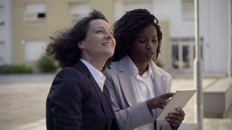 businesswomen with tablet pc discussing work