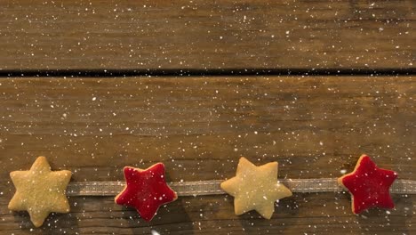 Nieve-Que-Cae-Con-Decoración-De-Estrellas-Navideñas.