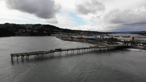 aerial view of teignmouth's grand pier, town and shaldon