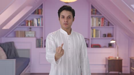 Angry-Indian-man-showing-middle-finger