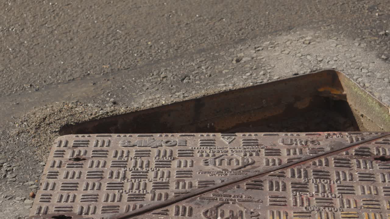 Open Manhole Cover Open to Remove Blockage in Drainage System