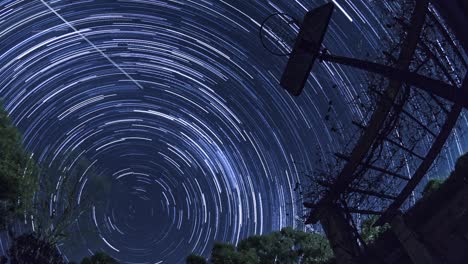 star trails over backyard basketball hoop