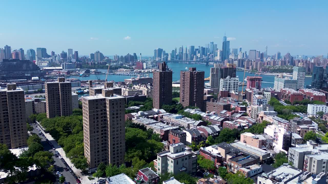 Drone aerial landscape towers buildings apartment blocks units residential housing city CBD skyline of New York USA America Manhattan East River Brooklyn travel tourism urban
